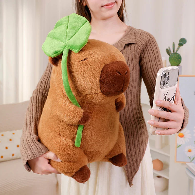 Adorable Kawaii Capybara Plushie Cuddling a Leaf