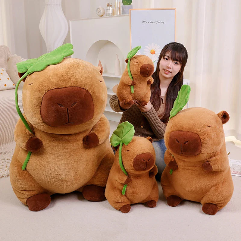 Adorable Kawaii Capybara Plushie Cuddling a Leaf