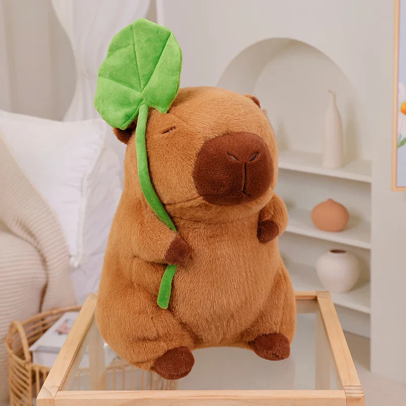 Adorable Kawaii Capybara Plushie Cuddling a Leaf