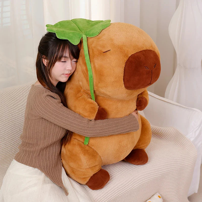 Adorable Kawaii Capybara Plushie Cuddling a Leaf