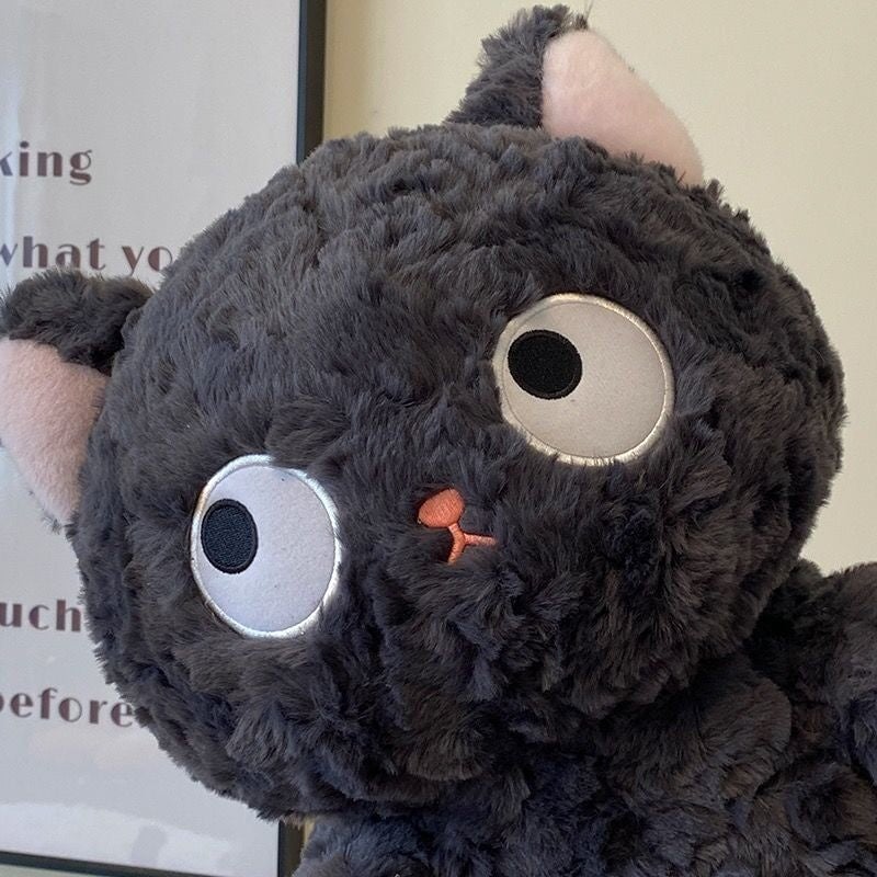Adorable Laying Jiji the Fluffy Black Cat Plush Toy