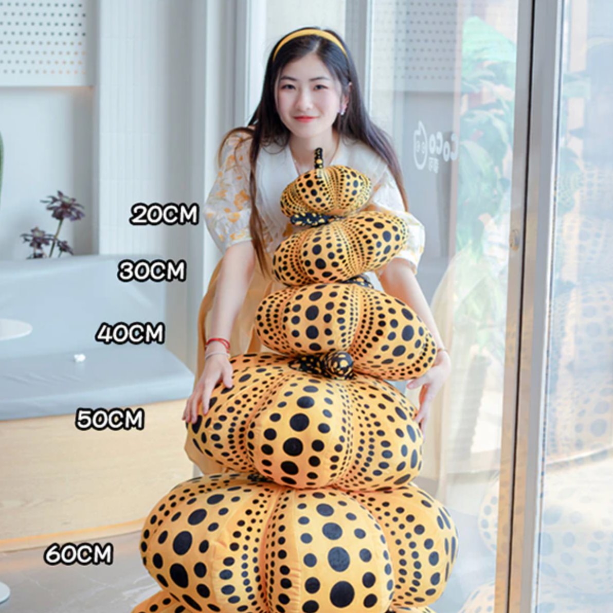 Delightfully Spooky Yayoi Kusama Pumpkin Plushies for Halloween Fun